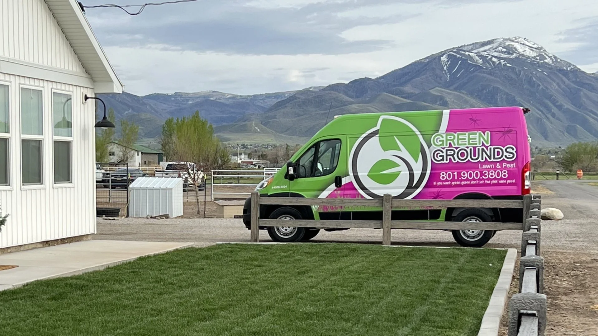 Company van in front of green lawn in Midway, UT.